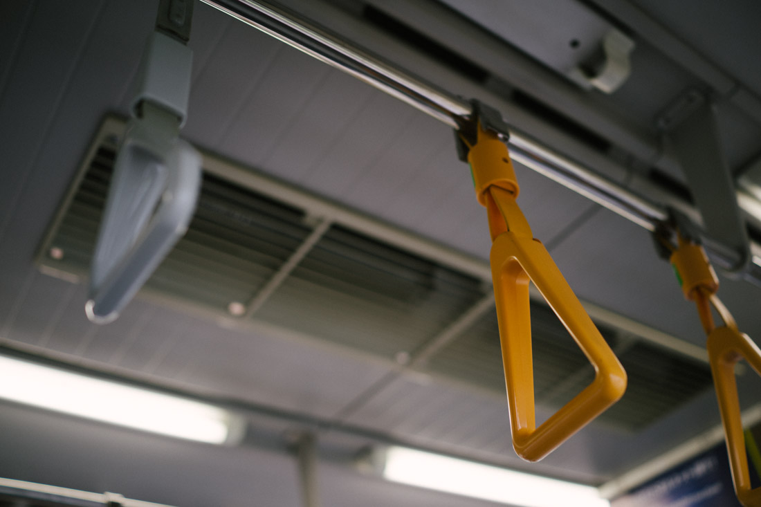 There are some priority seats and in those areas, if you’re holding on to one of these yellow handles, you cannot use your phone. We think it forces you to pay attention to whatever priority passengers you have by your side (pregnant ladies, elderly and disabled people, etc).