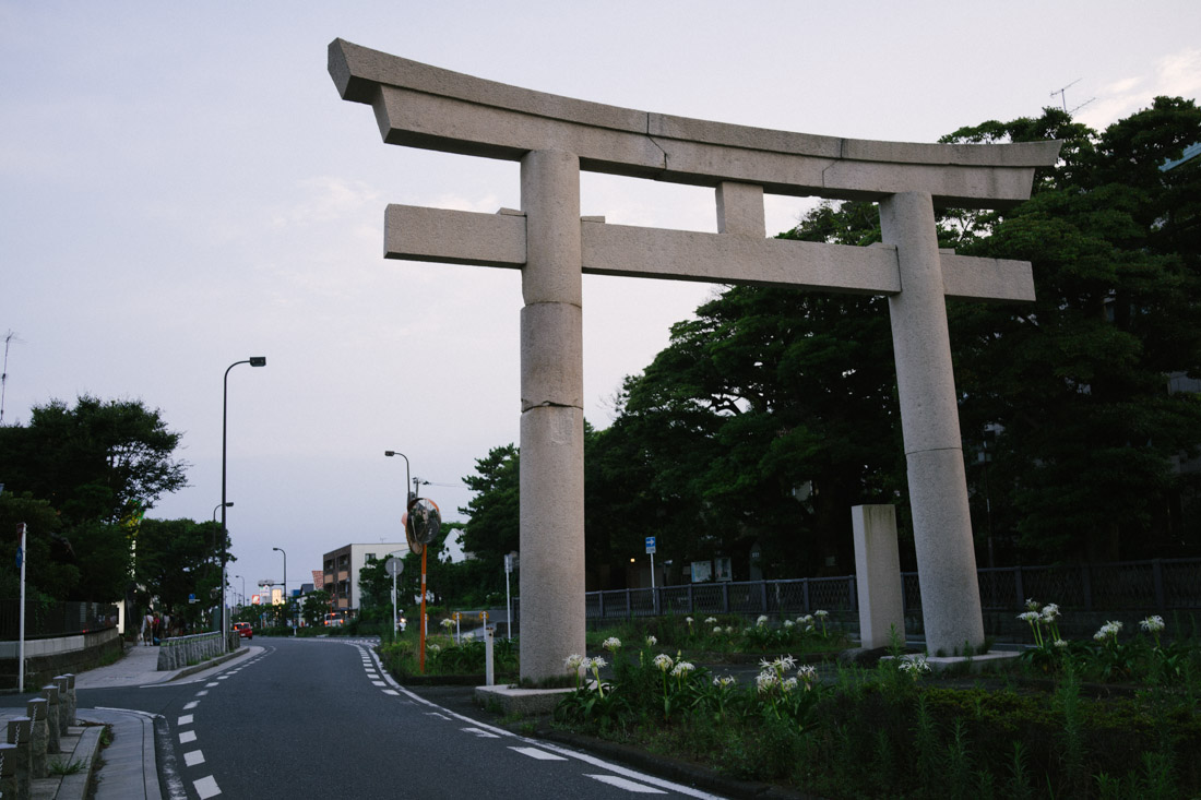 Main street to the beach features a stone tori.