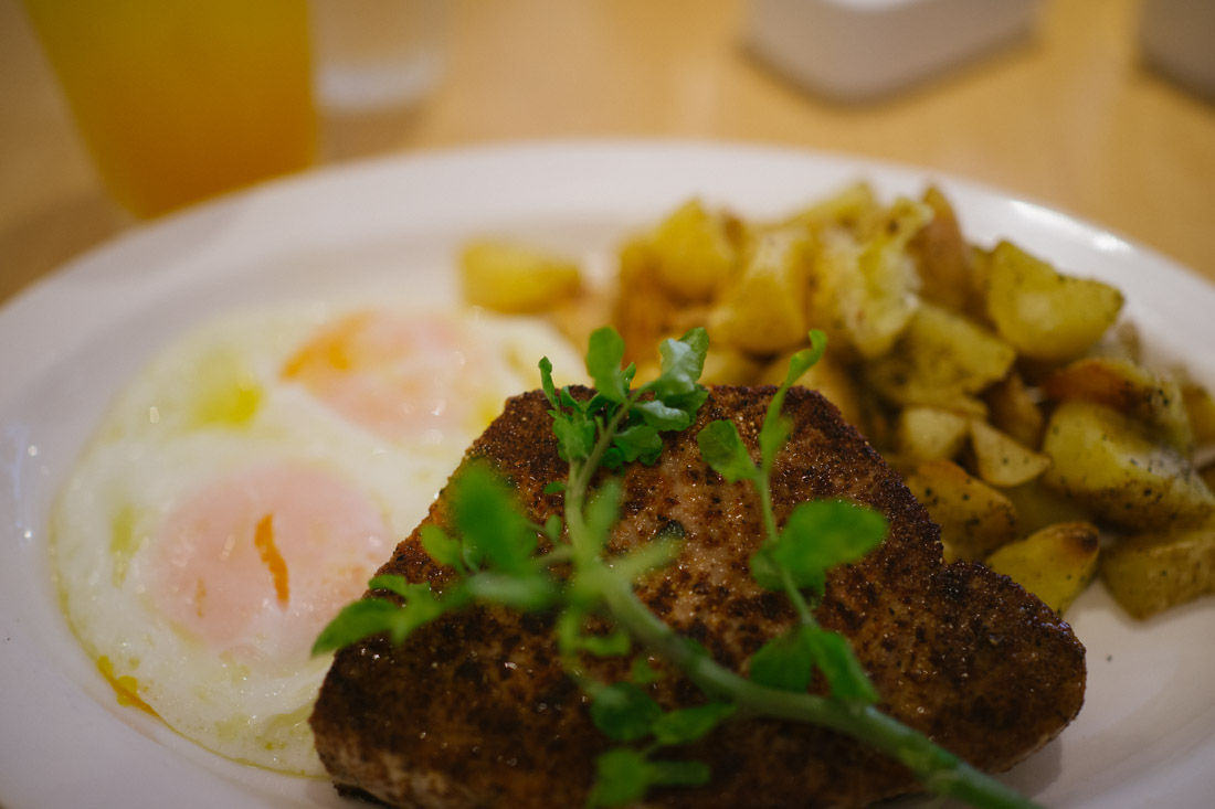 Seared ahi tuna, peppery potatoes and 2 over-easy eggs.