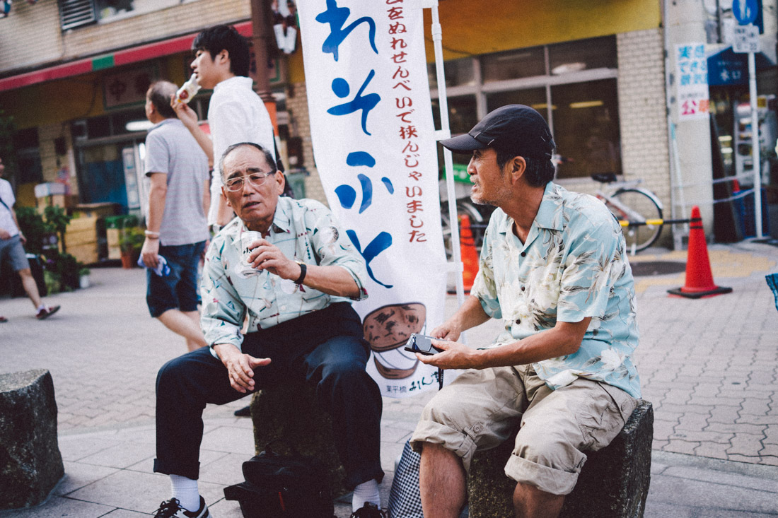 Friends chatted while sipping on some cold Asahi beer.