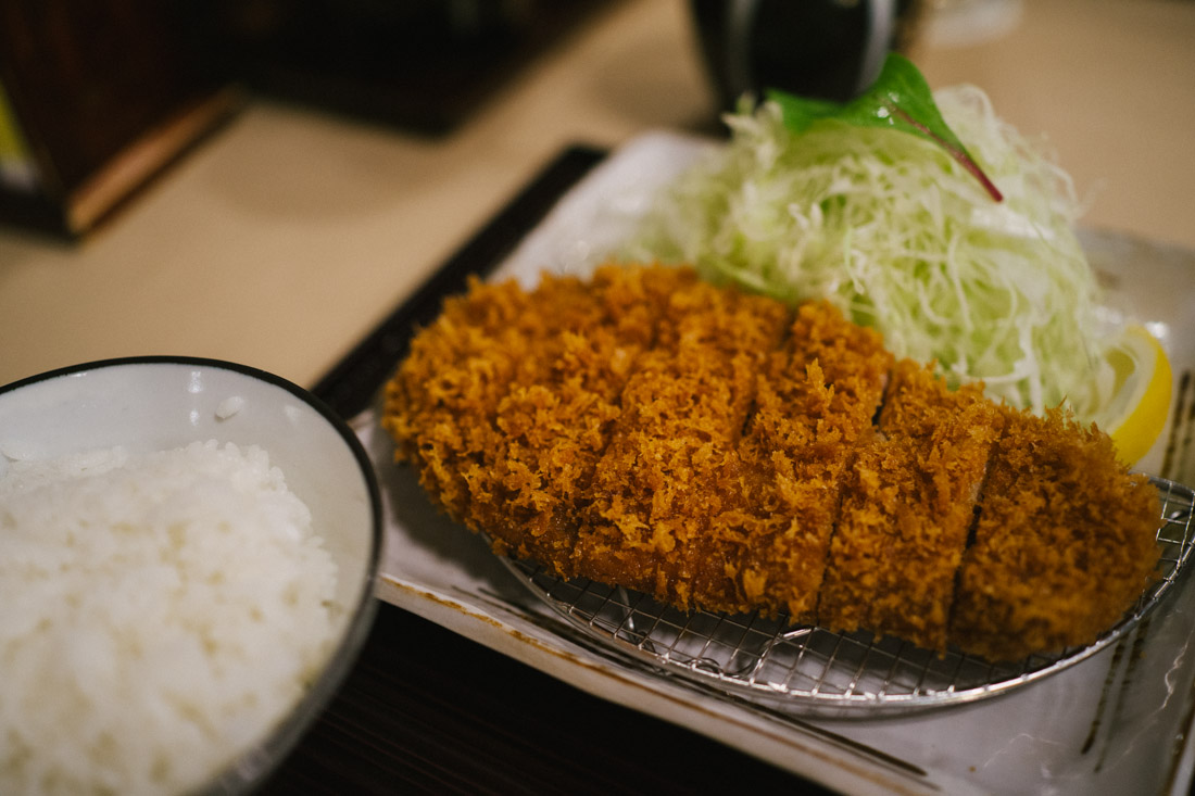 Classic Tonkatsu with finely chopped cabbage and white rice.