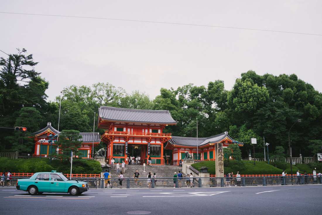 At the end of Shijo street, Yasaka shrine made itself visible with the gate bright colors.