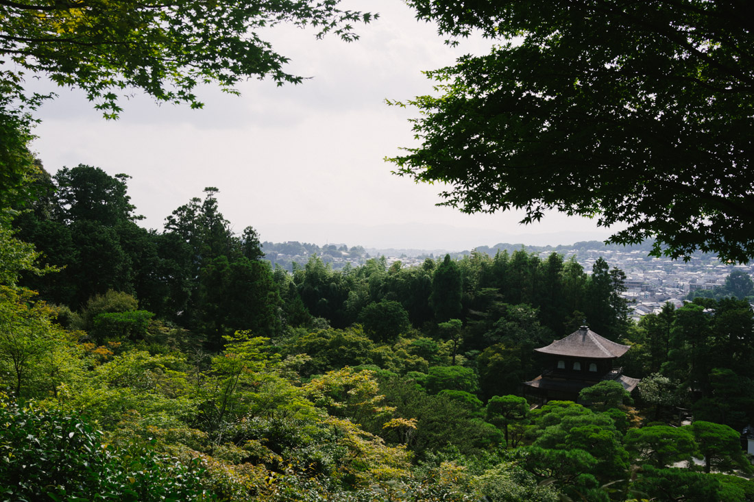 Ginkaku-ji itself seen from above with Kyoto on the background.