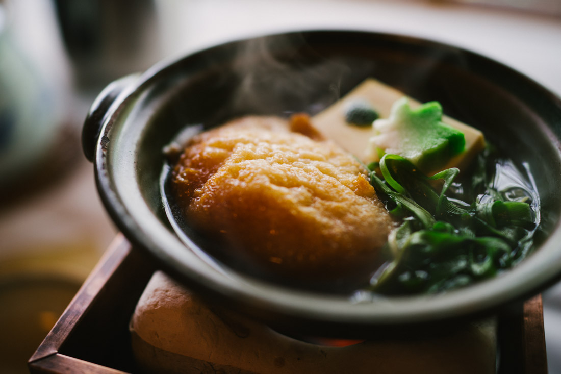 Tofu and leek soup with fried fluffy dough.